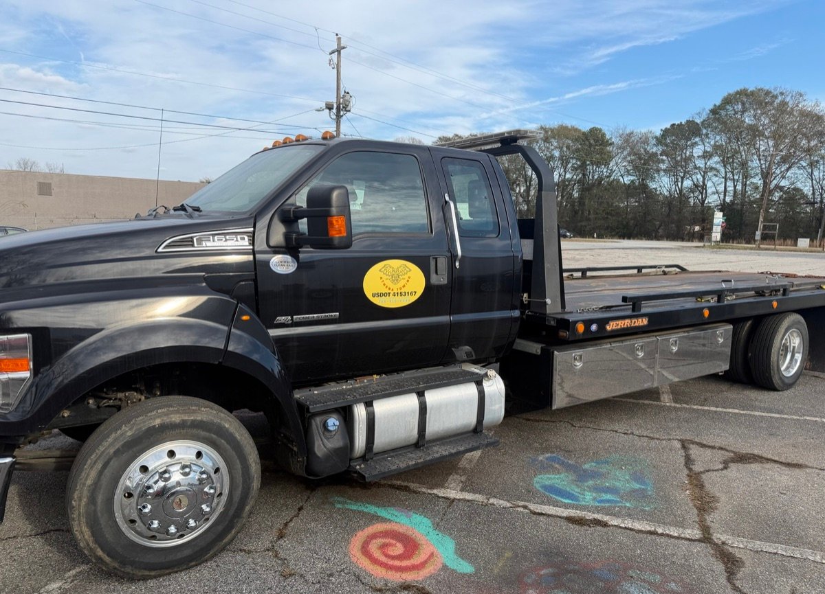 Athena Towing logo